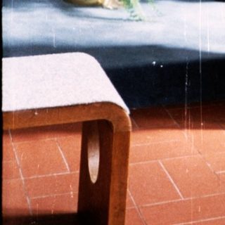 Woman holding prayer book in modern church.