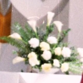 Woman holding prayer book in modern church.