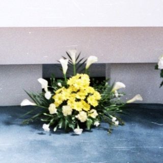 Elegant altar with floral arrangements and candles.