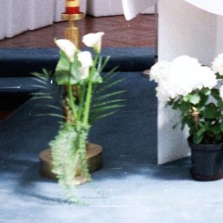 Elegant altar with floral arrangements and candles.
