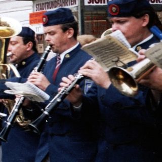 Street band performing for attentive audience.