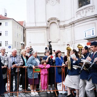 Street band performing for attentive audience.
