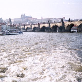 Historic Charles Bridge spanning Prague’s river.