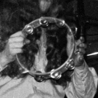 Jazz musician playing trumpet on stage.