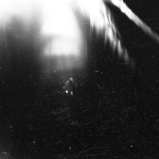 Blurred close-up of a glowing light source.