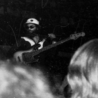 Live band performing in a crowded venue.