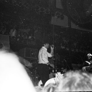 Live band performing in a crowded venue.