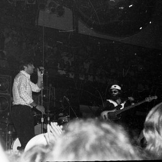 Live band performing in a crowded venue.