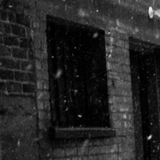 Heavy snow accumulation on city street.