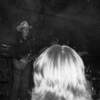 Live country band performing on stage.