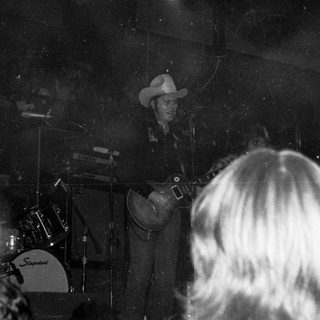 Live country band performing on stage.