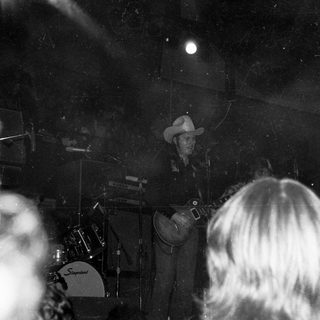 Live country band performing on stage.