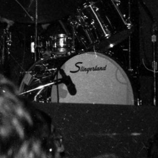 Live band performing on stage with singer.