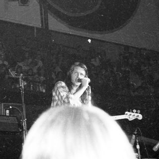 Live singer performing on stage.