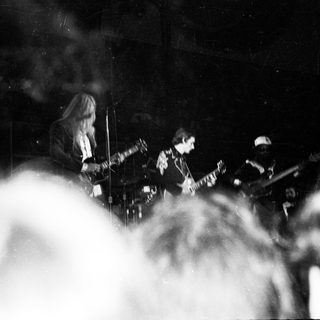 Band performing live on stage with smoke.