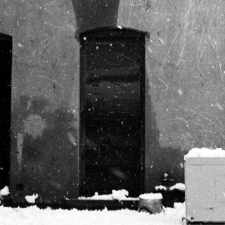 Snow-covered exterior of an old building.