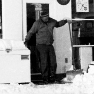 Snow clearing at Mobil gas station service area.