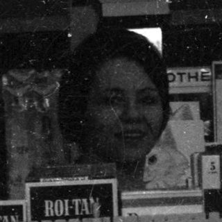 Vintage storefront signs for Roitán products.