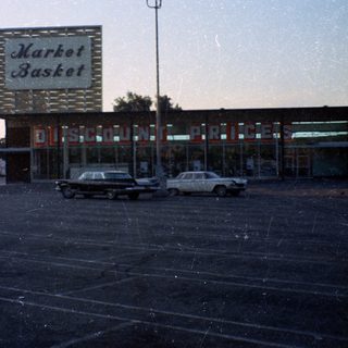 Vintage Market Basket discount store parking lot.