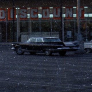 Vintage Market Basket discount store parking lot.