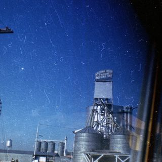 Industrial silos with "A.G. Edwards" sign.