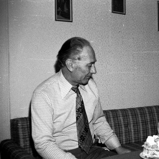 Man and child celebrating birthday with cake.