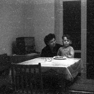 Family sharing meal indoors during evening.