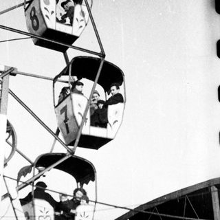 Ferris wheel gondolas with vintage heart symbols.