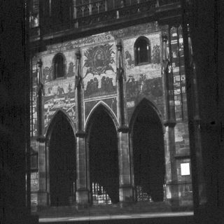 Gothic-style church facade with intricate stained glass.