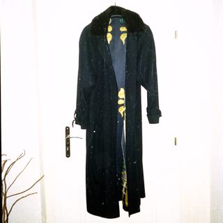 Vintage long coat with fur collar and yellow floral lining.