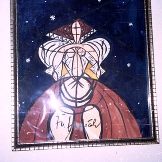 Stained glass portrait of woman in period headwear.
