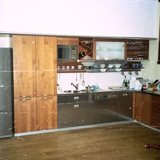 Kitchen under renovation with exposed walls and flooring.