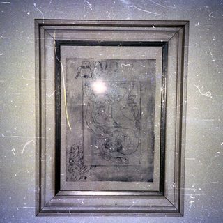 Ancient stone relief with carved hieroglyphics and symbols.