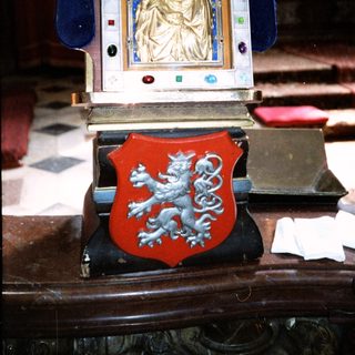 Religious clock with royal Madonna and coat of arms.