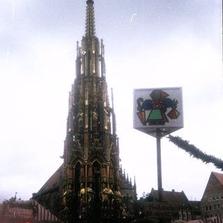 Gothic cathedral spire with festive decorations.
