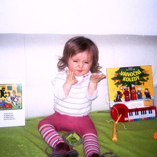 Baby playing indoors with toys, date 8.10.99.