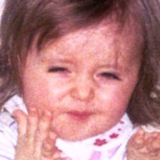 Baby playing indoors with toys, date 8.10.99.