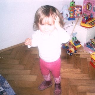 Young child playing with toys indoors.