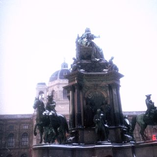 Equestrian statue monument with historical figures.