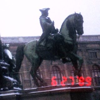 Equestrian statue monument with historical figures.