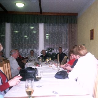 Group gathered for a formal dinner indoors.