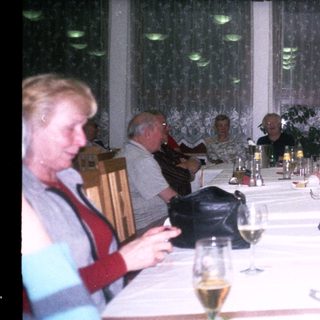 Group gathered for a formal dinner indoors.