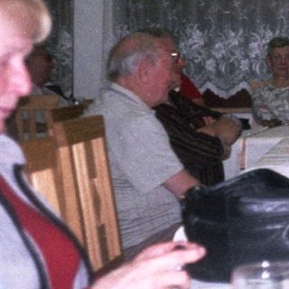 Group gathered for a formal dinner indoors.