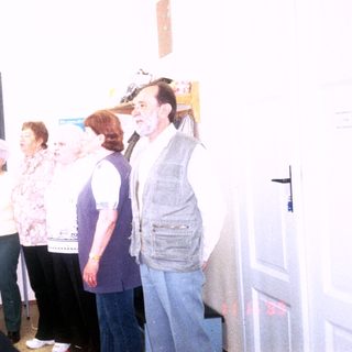 Group singing lesson or choir performance in classroom.