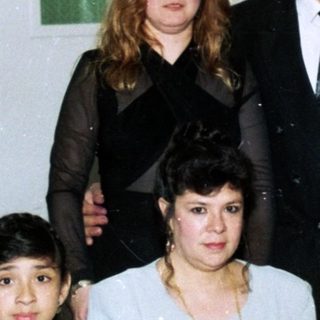 Family group photo at a formal event.