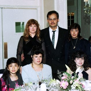 Family group photo at a formal event.