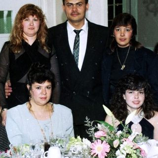 Family group photo at a formal event.