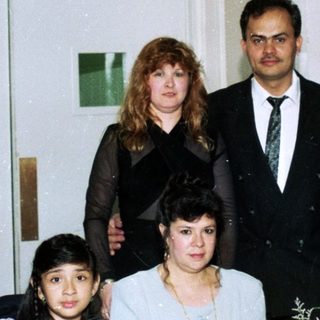 Family group photo at a formal event.