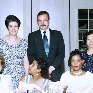 Family group posing at formal indoor event.