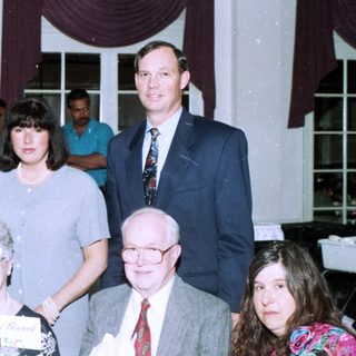 Family gathering at a formal indoor event.